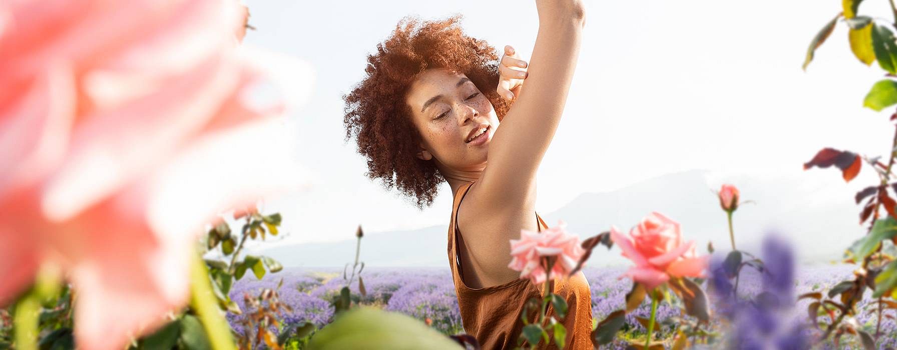 Happy woman in a flower field